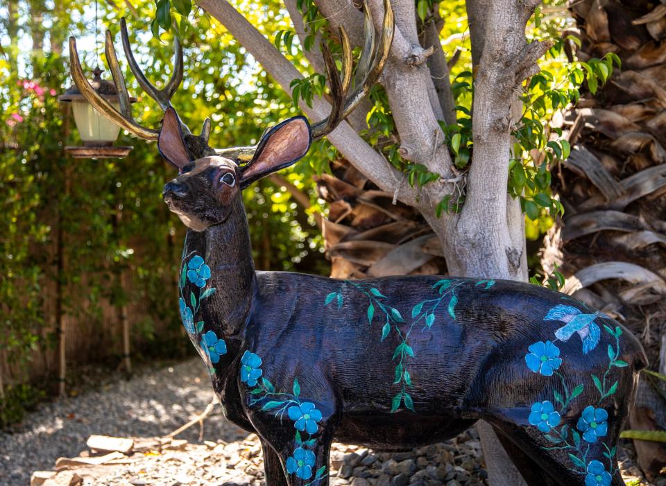 A deer painted by Ulrike is seen kept in her backyard at her home in Palm Springs, Calif., Wednesday, Sept. 21, 2022. 