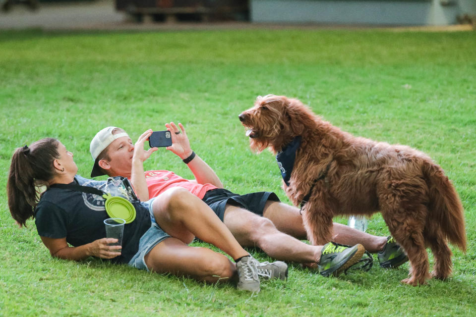 Nate Herd, Liza Vaccaro, and Philly take pictures as Dodger fans bring their dogs to the ballpark during "Bark in the Park" as the Oklahoma City Dodgers play the Salt Lake Bees at Chickasaw Bricktown Ballpark in Oklahoma City on Wednesday, Sept. 28, 2022.