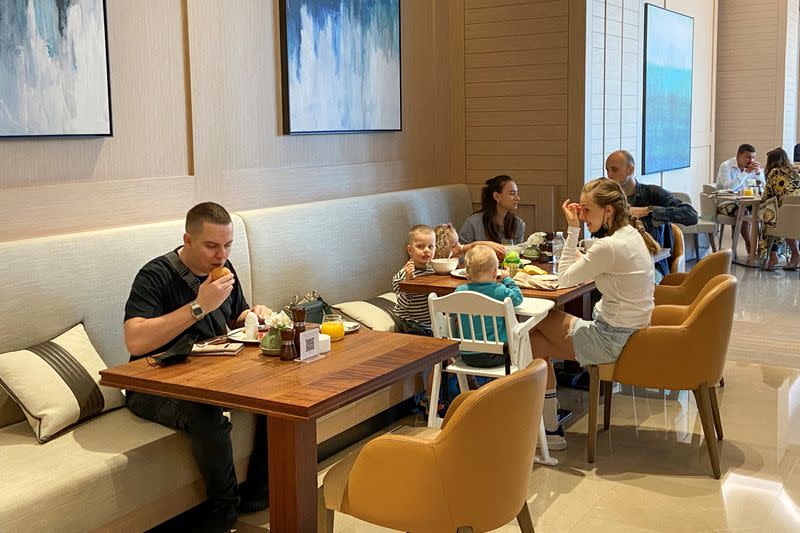 Tourists eat their breakfast at the Address Beach Resort in Dubai