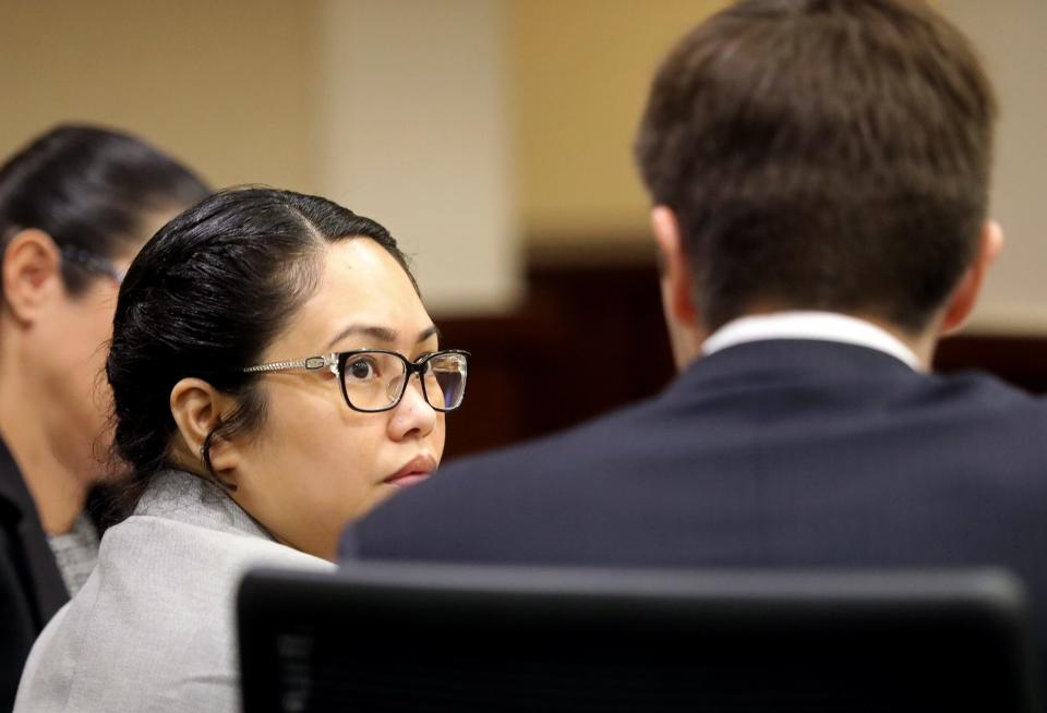 Katherine Magbanua listens to defense attorney Christopher DeCoste during her trial on Wednesday, May 18, 2022 on charges she was involved in the 2014 murder of Dan Markel.