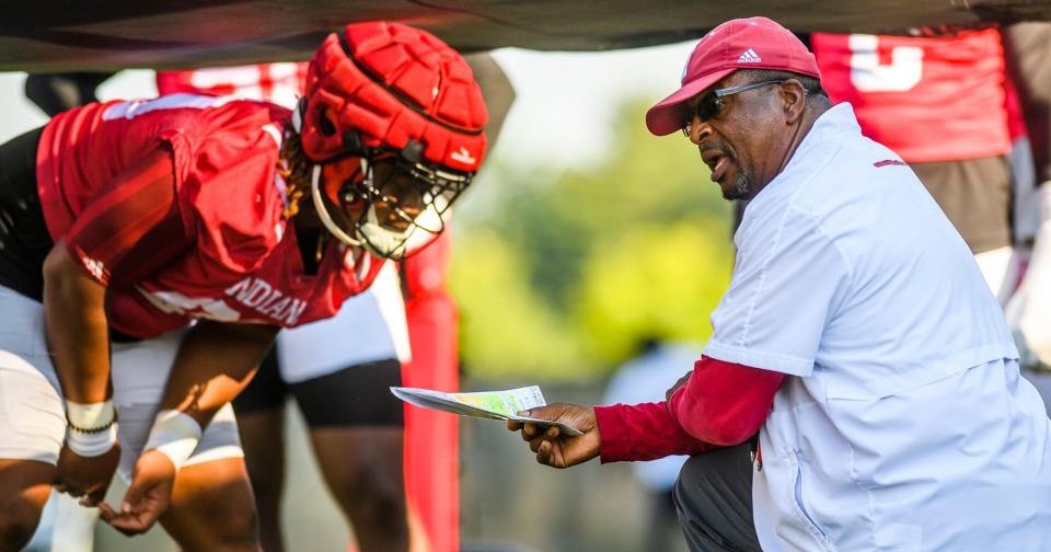 Indiana defensive line coach Paul Randolph instructs his players during fall football camp at Indiana University on Thursday, Aug. 11, 2022.