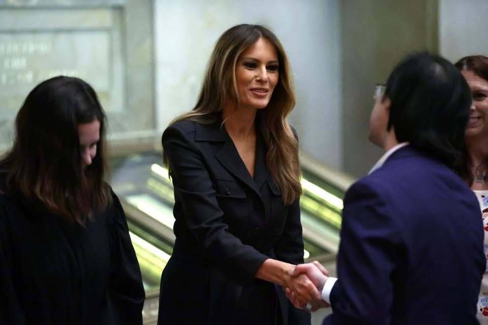 WASHINGTON, DC - DECEMBER 15: Former U.S. first lady Melania Trump shakes hands with new U.S. citizens during a naturalization ceremony at the National Archives on December 15, 2023 in Washington, DC. During the ceremony 25 people from 25 nations were sworn in as new U.S. citizens. (Photo by Alex Wong/Getty Images)
