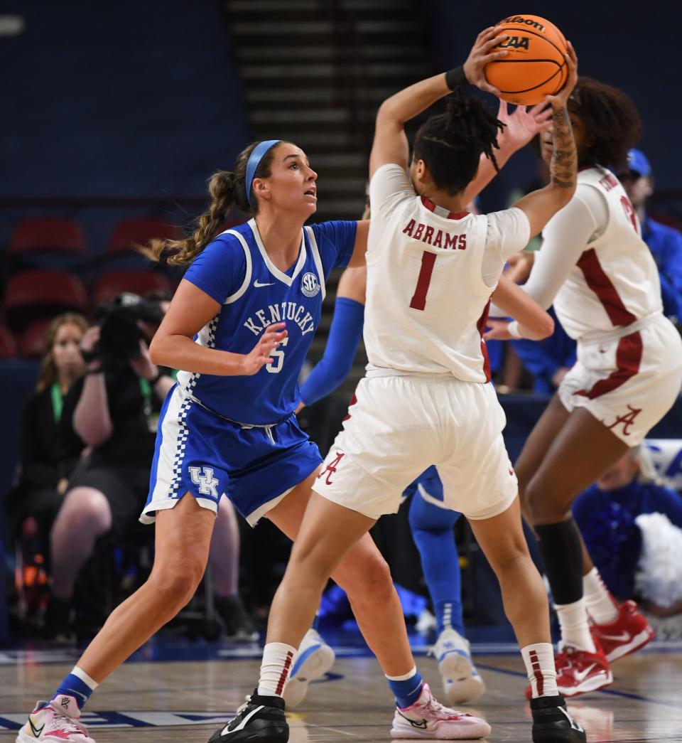 Alabama guard Megan Abrams (1) looks for an open teammate vs. Kentucky's Blair Green during their SEC Tournament game on Thursday.