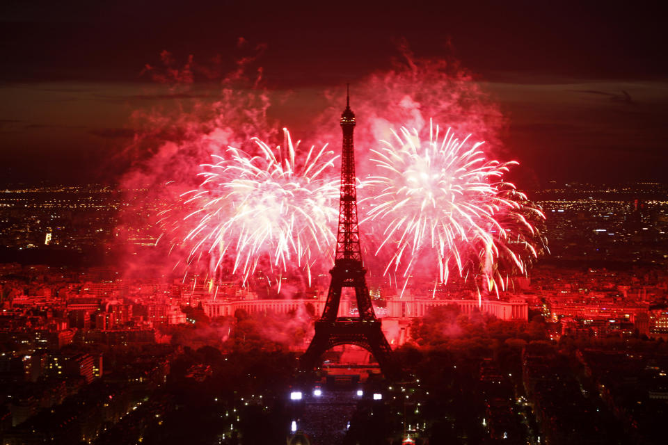 FILE - This July 14, 2011 file photo shows fireworks illuminating the Eiffel Tower in Paris during Bastille Day celebrations. (AP Photo/Thibault Camus, file)