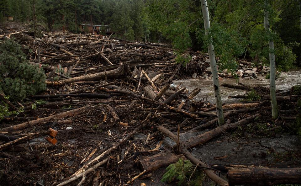 A debris field clogs the Cache La Poudre River after flash flooding ripped through a drainage near Black Hollow Road in the Poudre Canyon near Rustic, Colo. on Wednesday, July 21, 2021. 