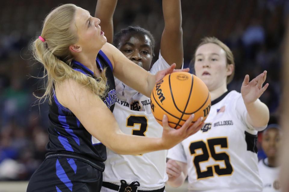 Lomega's Darcy Roberts puts up a shot as Calvin's E'Niyah Holmes, center, and Anderson Winningham defend during a Class B girls state basketball tournament quarterfinal game between Calvin and Lomega at State Fair Arena in Oklahoma City, Thursday, March 2, 2023. 
