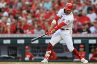 Cincinnati Reds' Joey Votto hits an RBI-single during the third inning of a baseball game against the Atlanta Braves in Cincinnati, Thursday, June 24, 2021. (AP Photo/Aaron Doster)