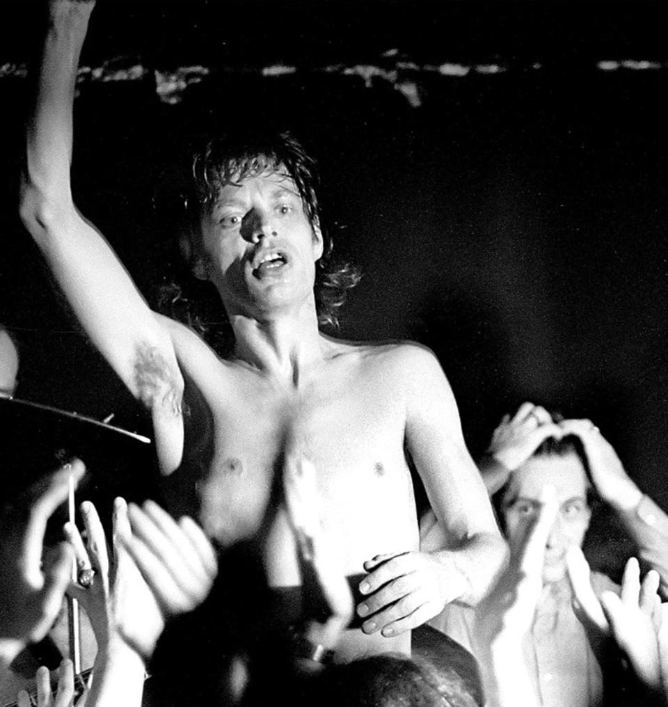 A sweaty and bare-chested Mick Jagger performs as Charlie Watts pounds the skins on Sept. 14, 1981 at Sir Morgan’s Cove.