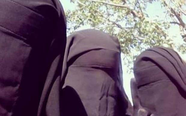 A woman believed to be British female jihadi Aqsa Mahmood, 20, (centre), pictured with friends  - Twitter