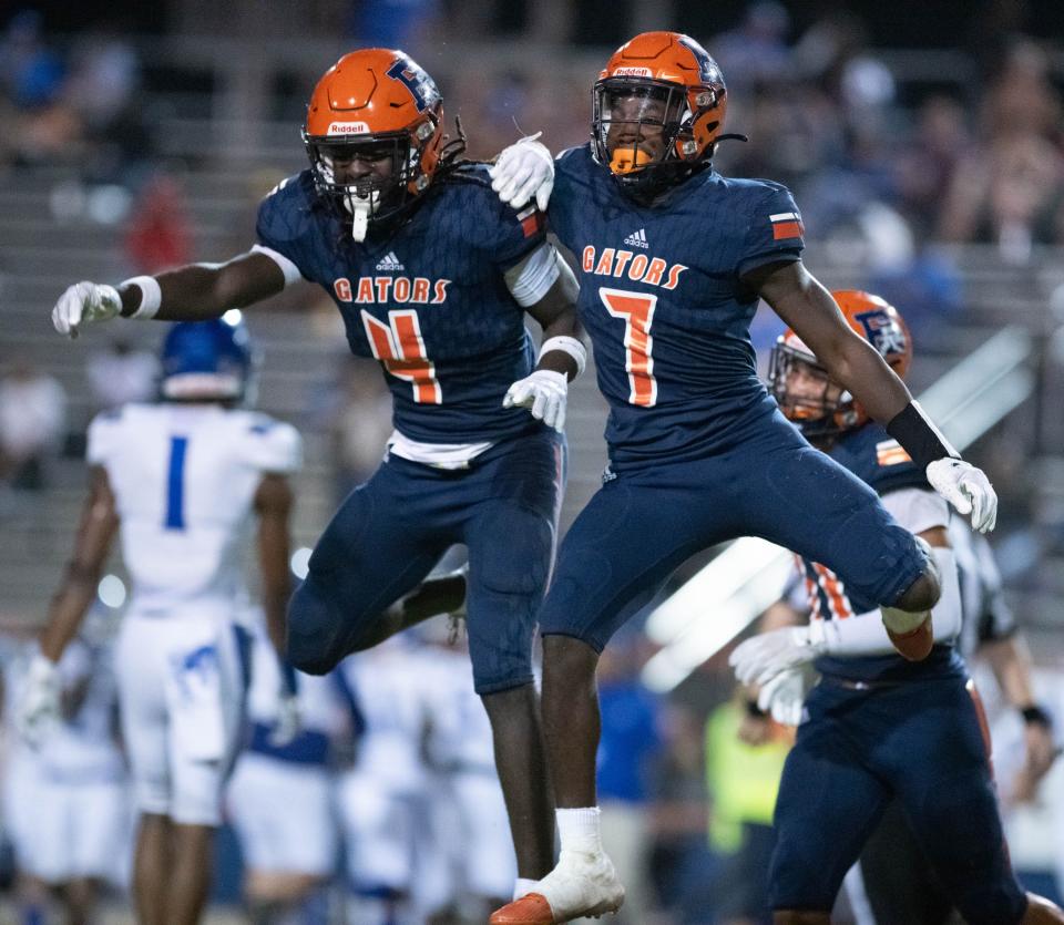 Jaylin Harris (7) celebrates his interception with Tadarius Wright (4) during the Washington vs Escambia football game at Escambia High School in Pensacola on Friday, Sept. 29, 2023.