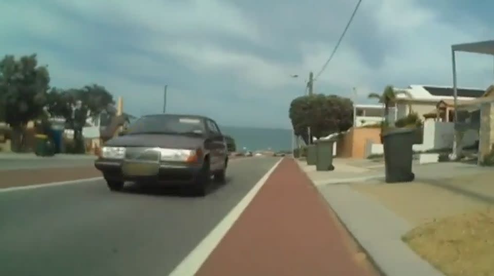 Rear vision shows the car moving closer and closer to the cycling lane as it moves up the hill. Source: 7 News