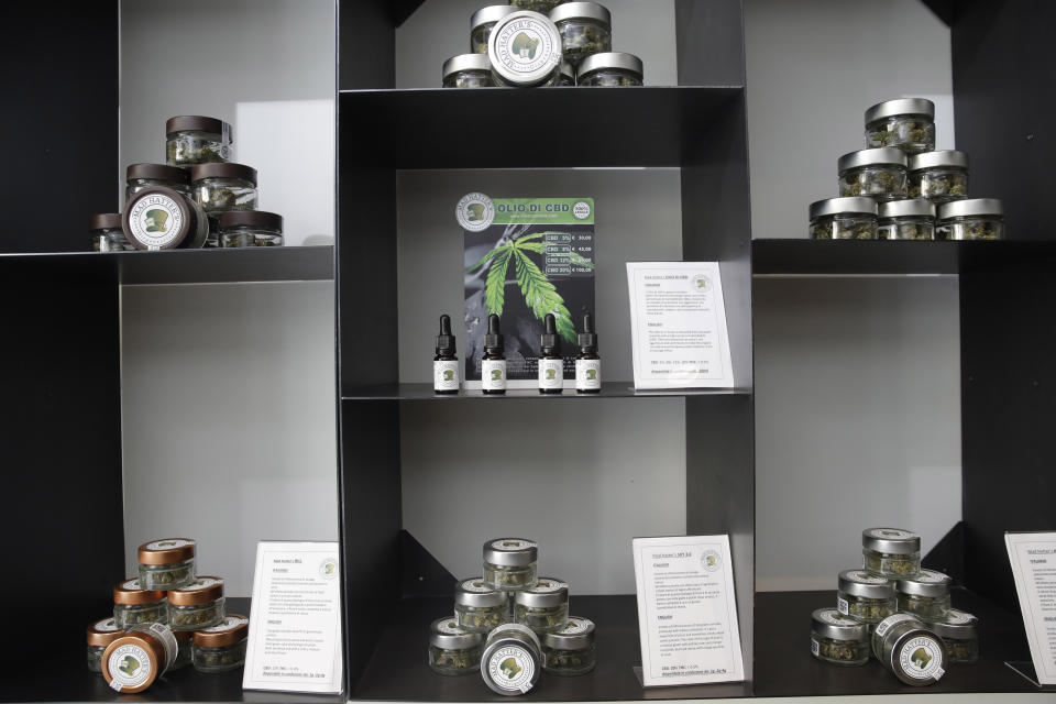 In this Thursday, June 6, 2019 photo, cannabis buds and products are displayed at a cannabis light store in Milan, Italy. Interior Minister Matteo Salvini has been an outspoken opponent of the marijuana light businesses that sprouted up around the country after pioneering 2016 legislation that many saw as a step toward eventual marijuana liberalization. (AP Photo/Luca Bruno)