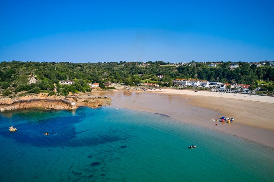 Autumn can still see sunny skies and warm waters at St Brelade’s (Getty/iStock)