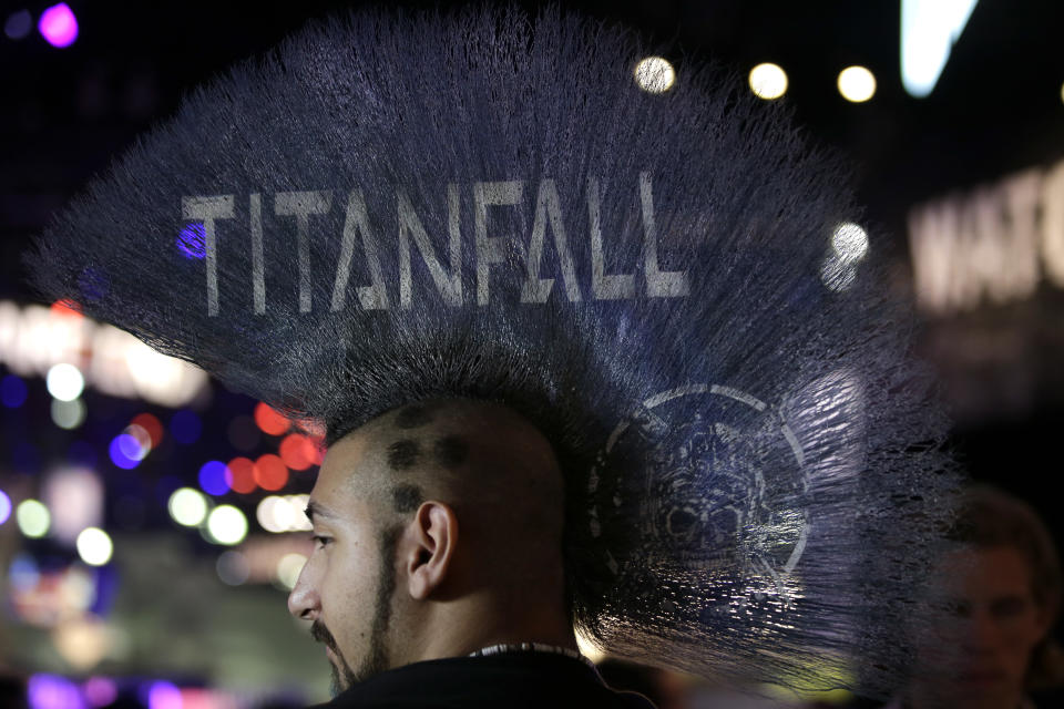 Ryan Hakik sports a Mohawk hairdo with the title of the video game "Titanfall" printed on it during the Electronic Entertainment Expo in Los Angeles, Wednesday, June 12, 2013. (AP Photo/Jae C. Hong)