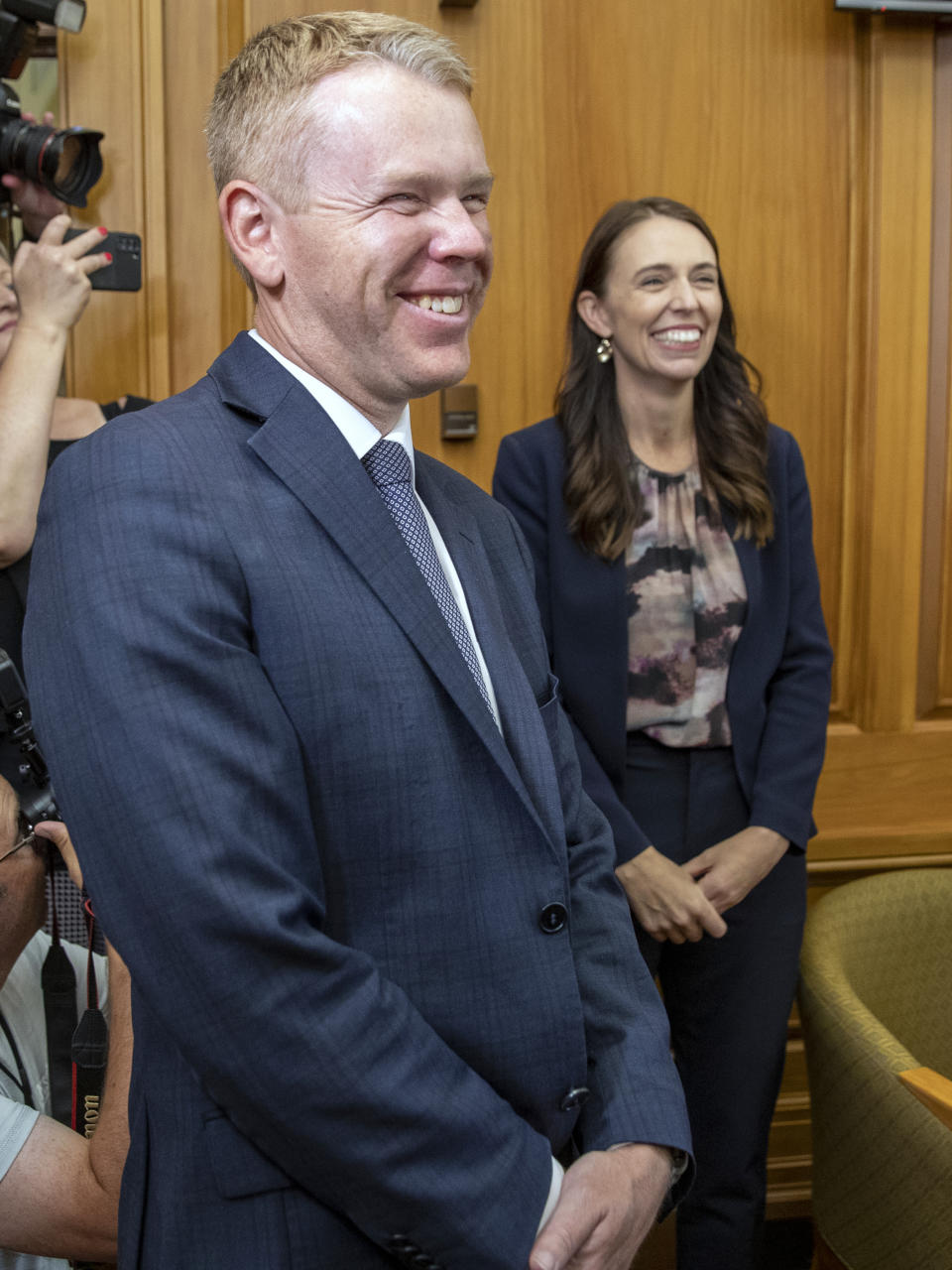 New Zealand Prime Minister Jacinda Ardern, right, and new Labour Party leader Chris Hipkins arrive for their caucus vote at Parliament in Wellington, Sunday, Jan. 22, 2023. Hipkins got the unanimous support of lawmakers from his party after he was the only candidate to enter the contest to replace Ardern, who shocked the nation of 5 million people last Thursday when she announced she was resigning. (Mark Mitchell/New Zealand Herald via AP)