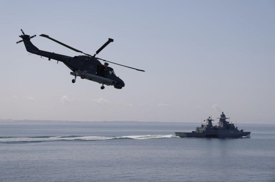 A Germany Navy Sea Lynx helicopter flies over the corvette Oldenburg in the Baltic Sea on June 05, 2023 near Rostock, Germany.