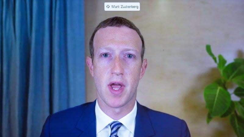 CEO of Facebook Mark Zuckerberg appears on a monitor as he testifies remotely during the Senate Commerce, Science, and Transportation Committee hearing 'Does Section 230's Sweeping Immunity Enable Big Tech Bad Behavior?', on Capitol Hill, October 28, 2020 in Washington, DC.