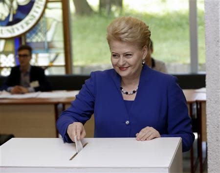 Lithuania's President Dalia Grybauskaite casts her vote during European Parliament and Lithuania's presidential elections in Vilnius May 25, 2014. REUTERS/Ints Kalnins