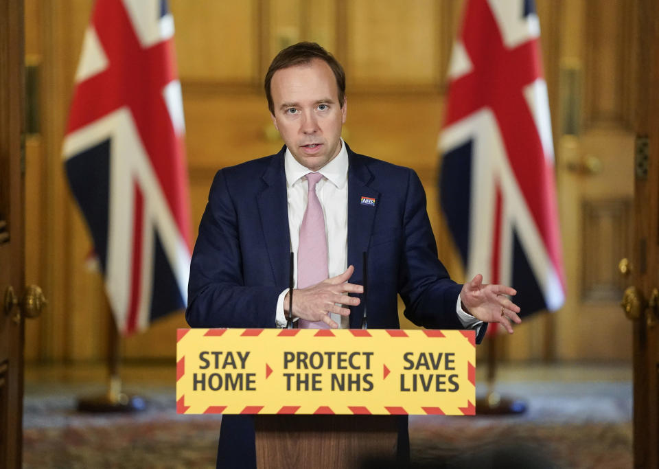 In this photo provided by 10 Downing Street, Britain's Health Secretary Matt Hancock gestures during a coronavirus media briefing in Downing Street, London, Monday,  May 4, 2020. (Andrew Parsons/10 Downing Street via AP)