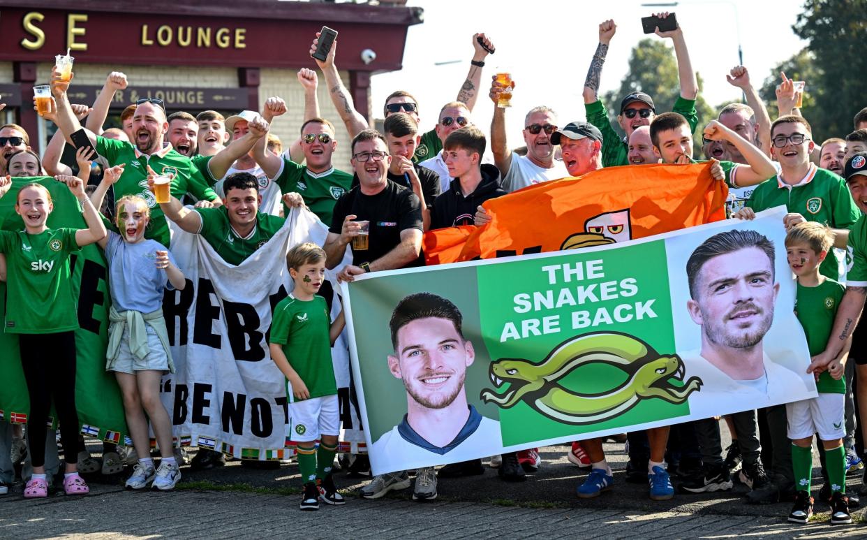 Ireland fans hold up a banner criticising Declan Rice and Jack Grealish