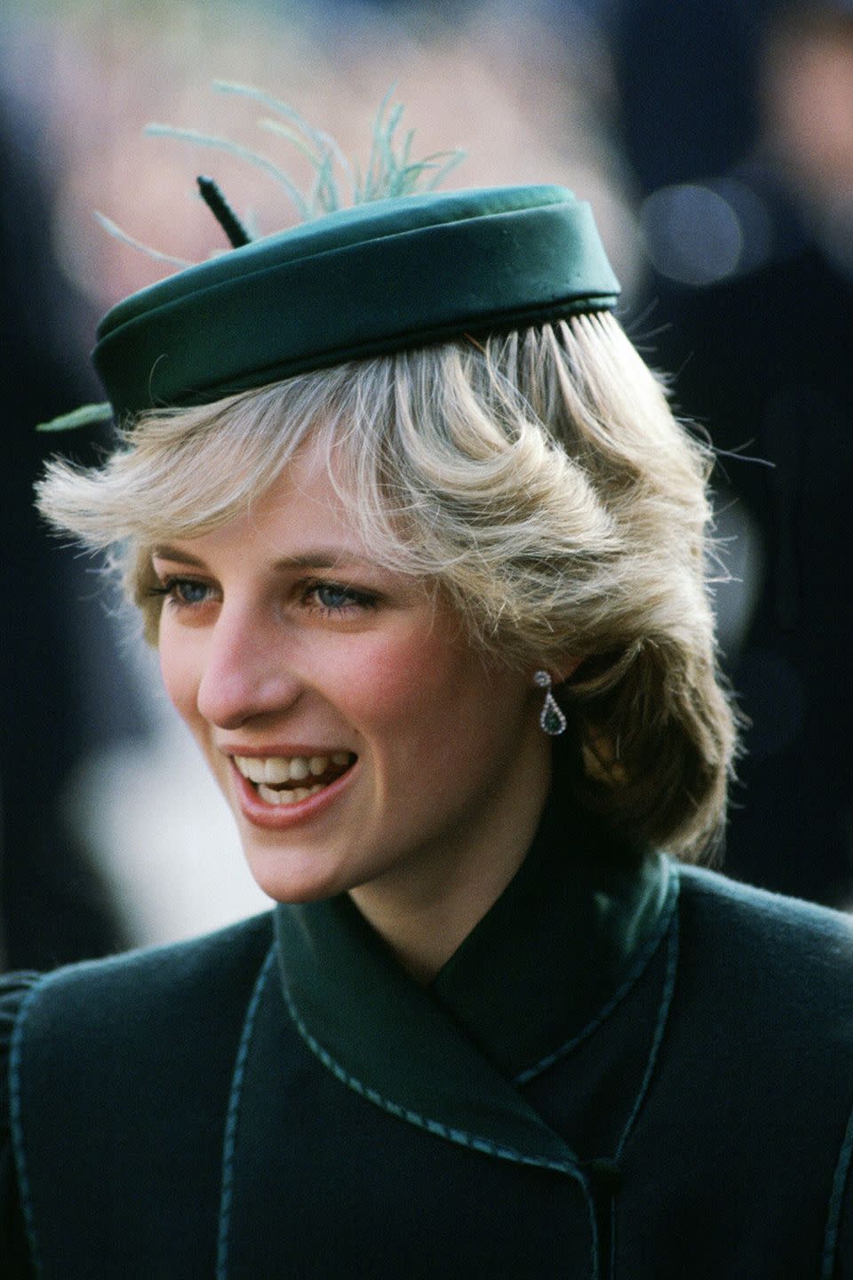 <p>Attending a charity concert at the Royal Albert Hall in a hunter-green circle cap.</p>