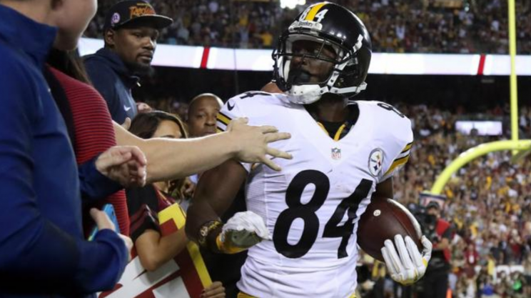 Antonio Brown celebrates a TD as Kevin Durant watches. (USA Today Sports)