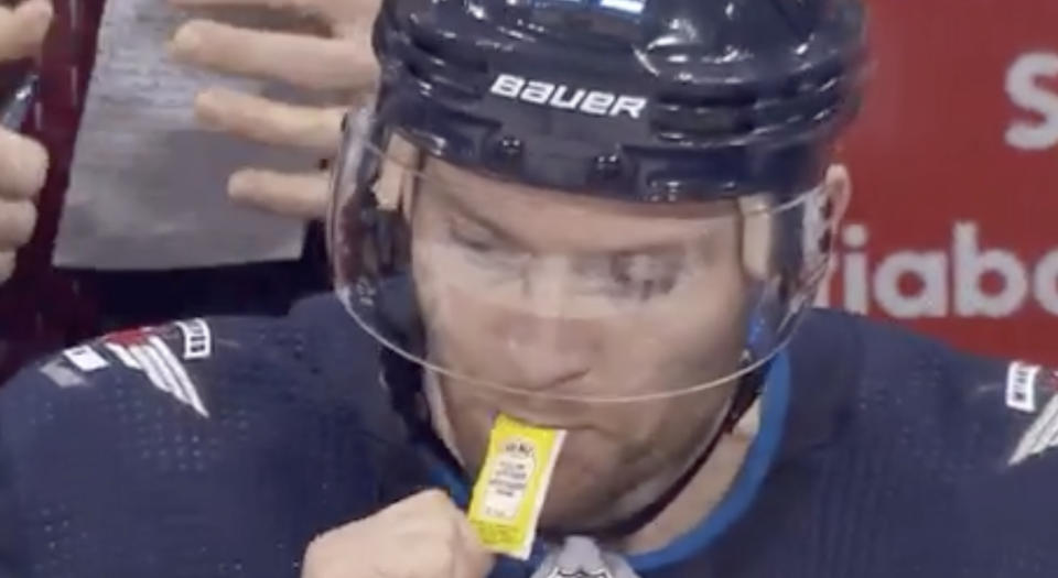 Mark Letestu went with an interesting culinary decision while on the bench during a preseason game against the Edmonton Oilers on Thursday night. (Twitter//@BradyTrett)