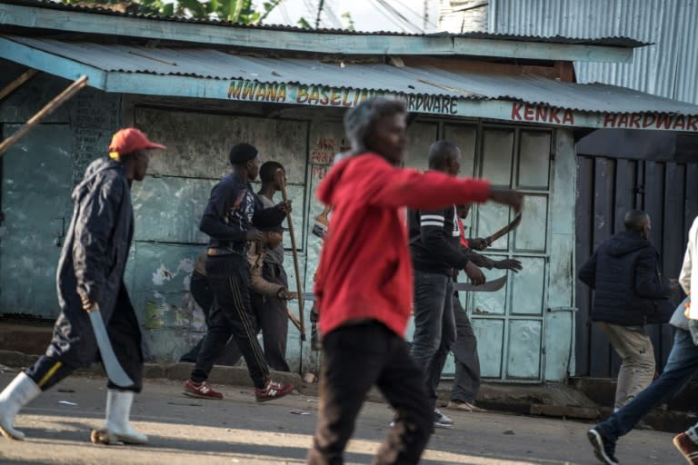 Groups of young men carrying machetes and knives could be seen stalking through the streets of the Kawangware slum in Nairobi