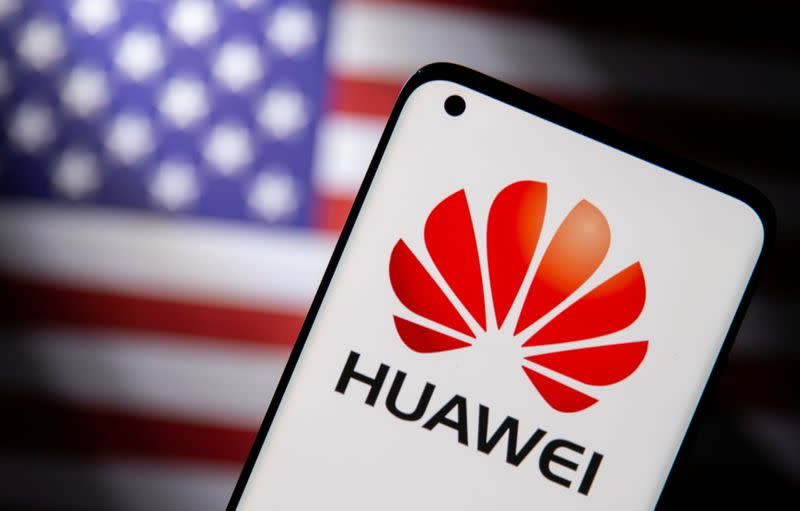 FILE PHOTO: Smartphone with a Huawei logo is seen in front of U.S. flag in this illustration