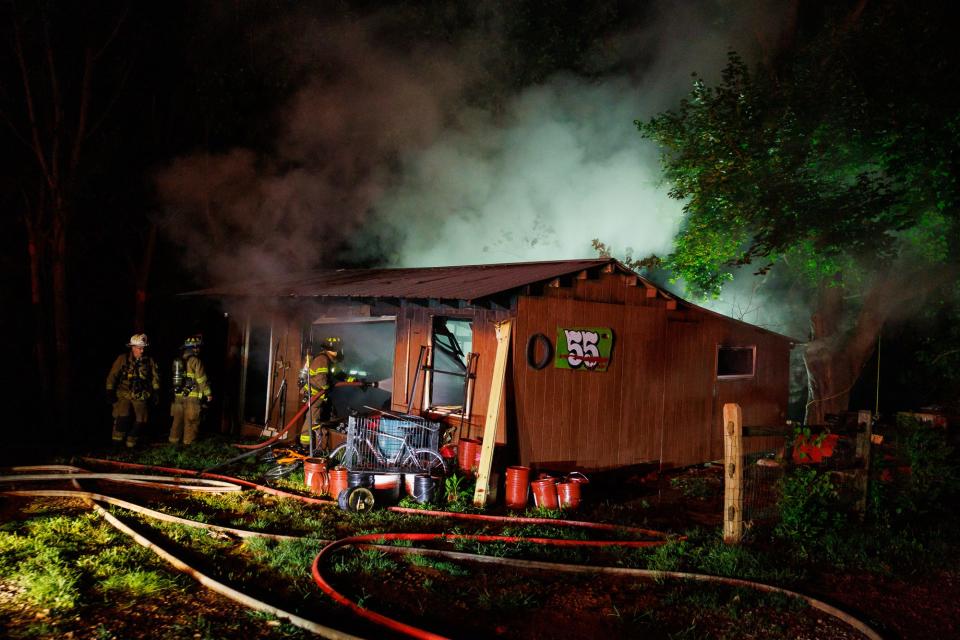 Firefighters work at the scene of a working garage fire on the 2600 block of Wilkens Lane, Saturday, July 27, 2024, in Codorus Township.