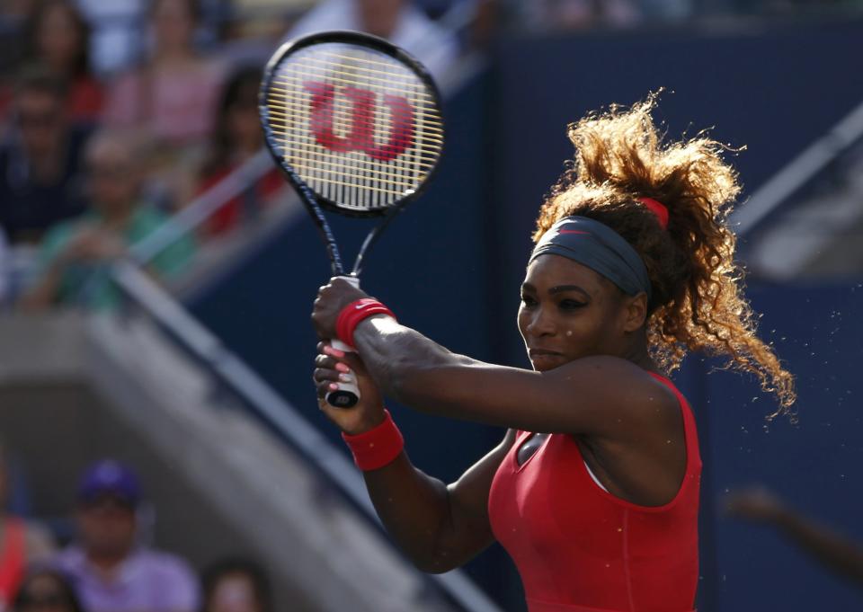 Serena Williams hits a return to Azarenka of Belarus during their women's singles final match at the U.S. Open tennis championships in New York