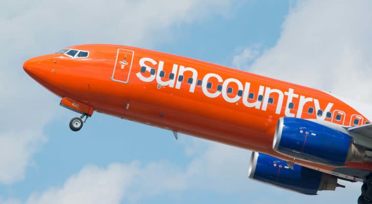 A Sun Country Airlines plane taking off.