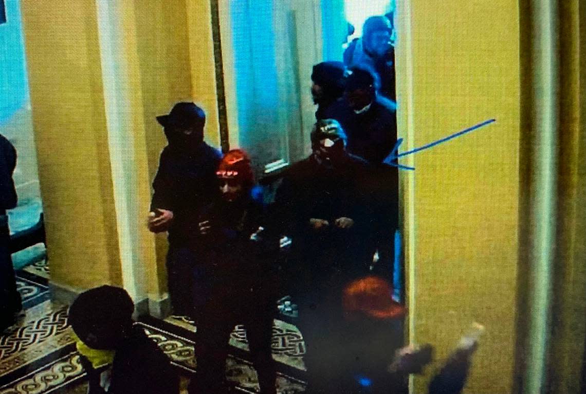 Prosecutors say this photo from U.S. Capitol surveillance video shows Lloyd Casimiro Cruz Jr., of Polo, Missouri, entering the building through the Senate wing doors.