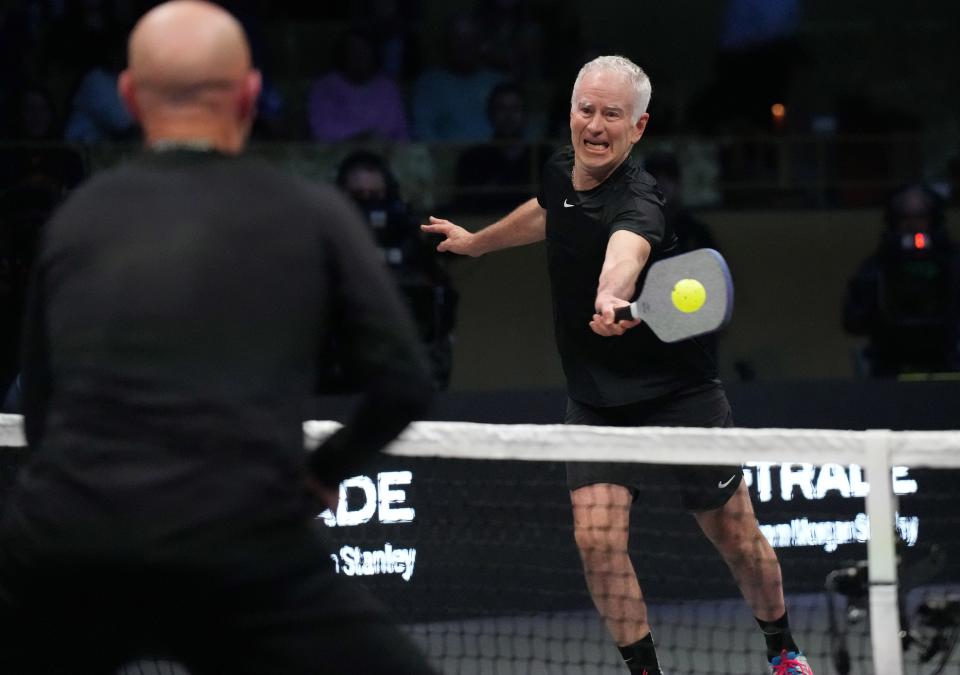 John McEnroe returns a volley during Pickleball Slam 2.