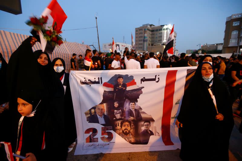 Iraqis march in Najaf on the anniversary of the anti-government protests