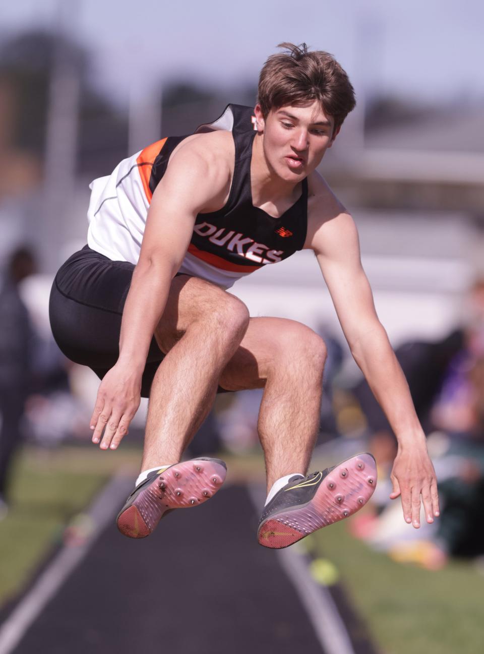 Marlington's Cameron Evanich competes in the long jump at the Stark County Track and Field Championships last month.