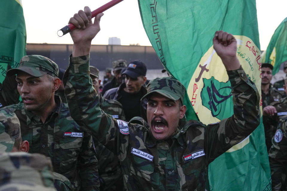 Members of an Iraqi Shiite militant group attend the funeral of an fighter who was killed in a U.S. airstrike Province, in Baghdad, Iraq, Thursday, Jan. 4, 2024. The Popular Mobilization Force - a coalition of militias that is nominally under the control of the Iraqi military - announced in a statement that its deputy head of operations in Baghdad, Mushtaq Taleb al-Saidi, or "Abu Taqwa," had been killed in the strike. (AP Photo/Hadi Mizban)