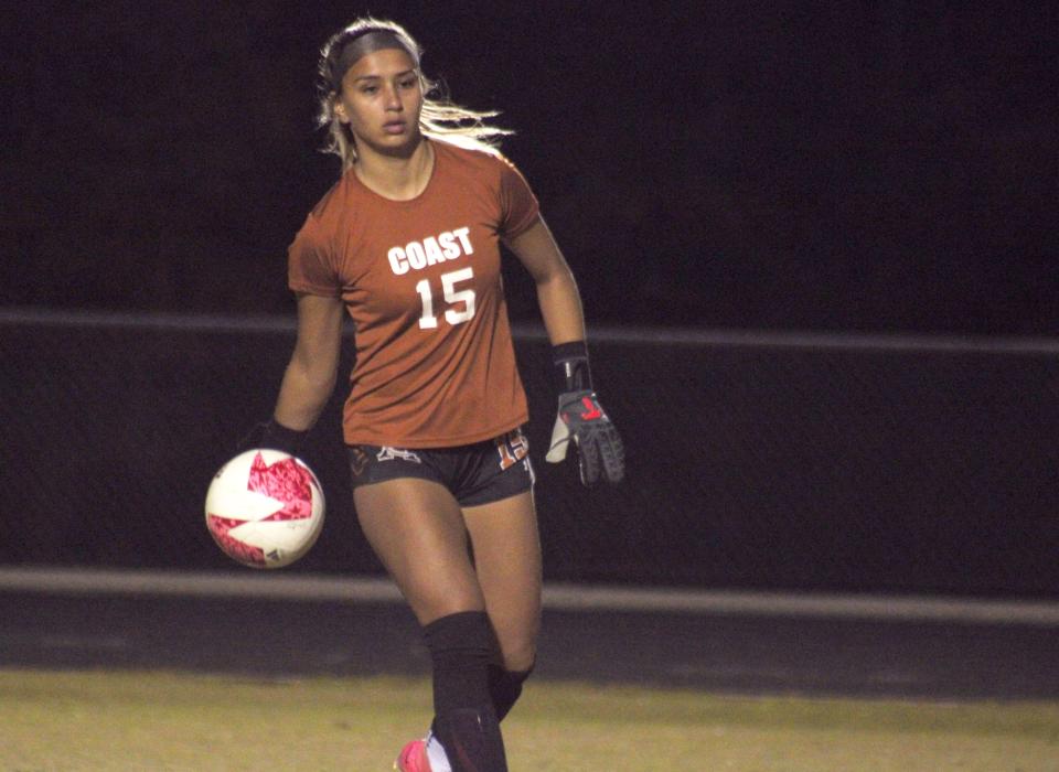 Atlantic Coast goalkeeper Gaby Rourke (15) rolls the ball out to her defense during a Dec. 5 soccer game against St. Johns Country Day.