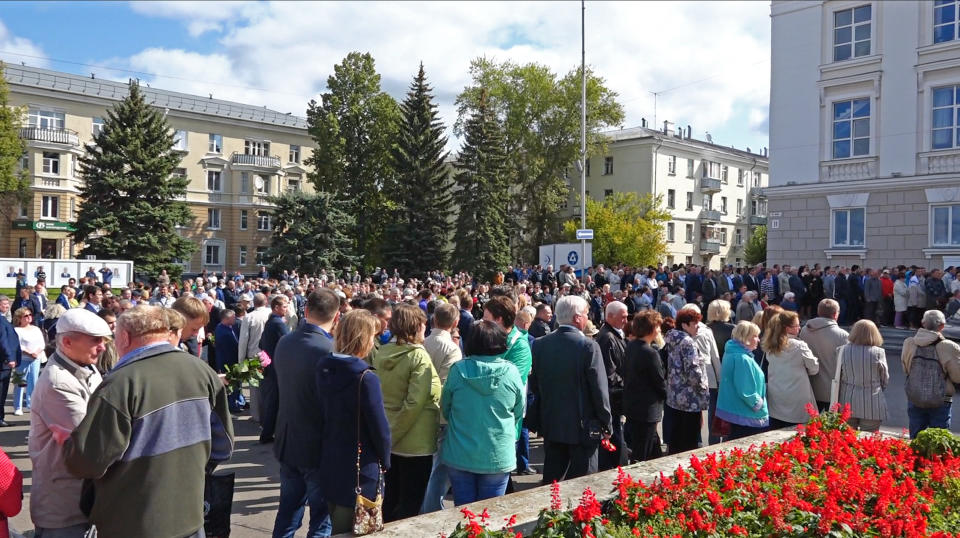 In this grab taken from a footage provided by the Russian State Atomic Energy Corporation ROSATOM press service, people gather for the funerals of five Russian nuclear engineers killed by a rocket explosion in Sarov, the closed city, located 370 kilometers (230 miles) east of Moscow, Monday, Aug. 12, 2019. Thousands of people have attended the burial of five Russian nuclear engineers killed by an explosion during tests of a new rocket. The engineers, who died on Thursday, were laid to rest Monday in the city of Sarov that hosts Russia’s main nuclear weapons research center. (Russian State Atomic Energy Corporation ROSATOM via AP)