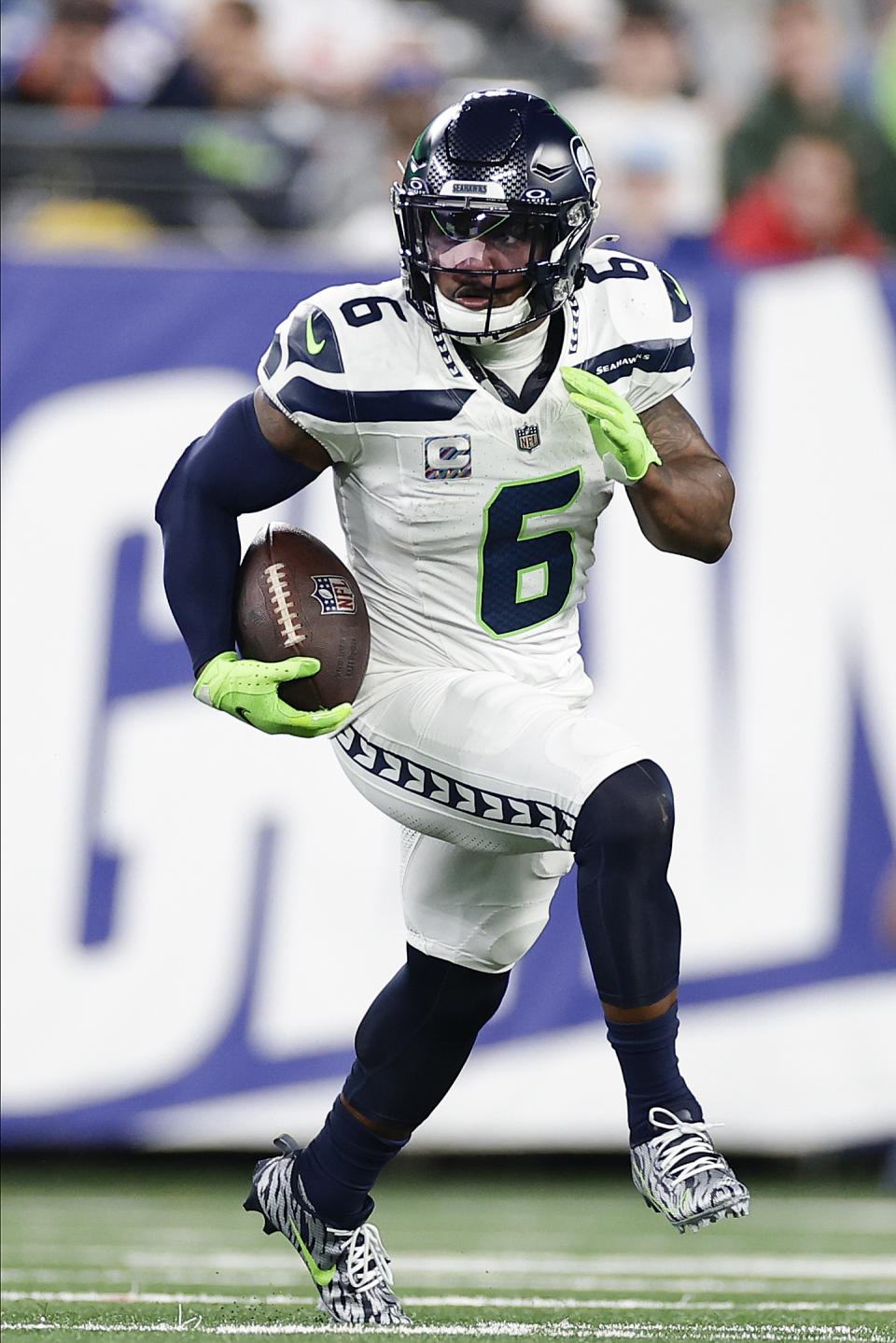 Seattle Seahawks safety Quandre Diggs (6) carries the ball after intercepting a pass against the New York Giants during the second half of an NFL football game, Monday, Oct. 2, 2023, in East Rutherford, N.J. (AP Photo/Adam Hunger)