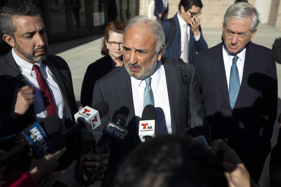 Joe Spencer, center, lawyer of defendant Patrick Crusius, speaks to the media after his client's plea hearing in federal court in El Paso, Texas, Wednesday, Feb. 8, 2023. Crusius pleaded guilty to federal charges accusing him of killing 23 people in a racist attack at an El Paso Walmart in August 2019, changing his plea weeks after the U.S. government said it wouldn't seek the death penalty for the hate crimes and firearms violations. (AP Photo/Andrés Leighton)