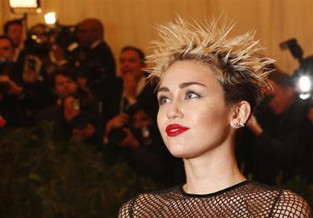 Singer and actress Miley Cyrus arrives at the Metropolitan Museum of Art Costume Institute Benefit celebrating the opening of "PUNK: Chaos to Couture" in New York, May 6, 2013. REUTERS/Lucas Jackson