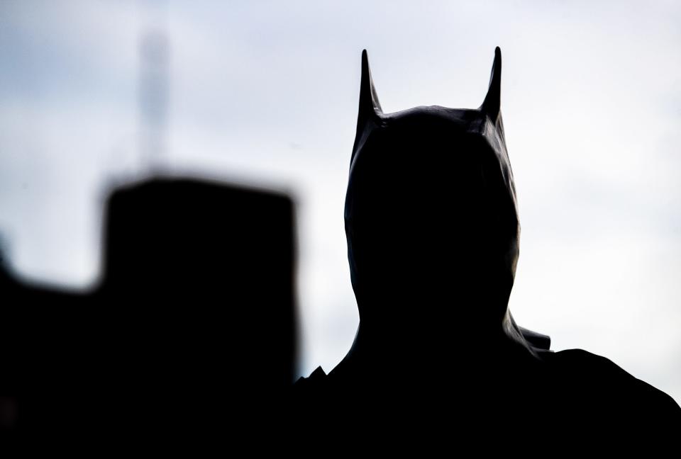 Scott Pyles with Pro Clean International dressed as The Batman while cleaning the windows at Norton Children’s Hospital on Thursday, June 22, 2023