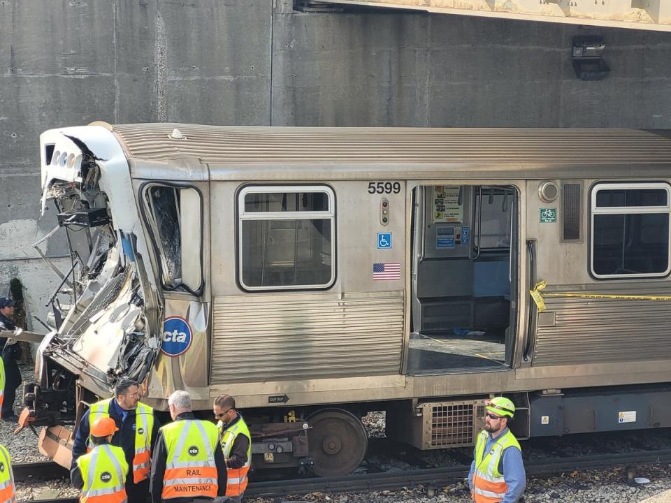 This handout photo provided by the Chicago Fire Department on November 16, 2023, shows workers examining the damage to a CTA train in Chicago, Illinois (Chicago Fire Department/AFP via)