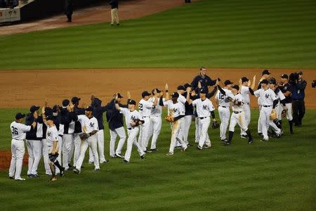 Oct 1, 2015; Bronx, NY, USA; New York Yankees celebrate the win against the Boston Red Sox at Yankee Stadium. New York Yankees won 4-1. Anthony Gruppuso-USA TODAY Sports