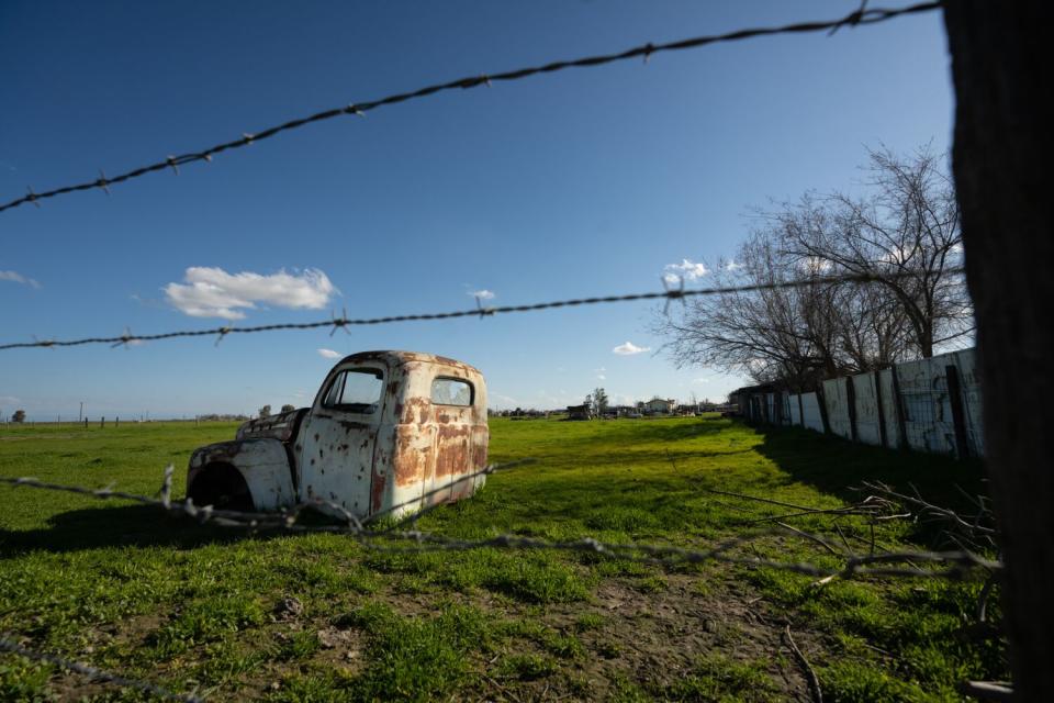 An old truck cab sits in a field in the small city of Allensworth.