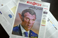 The front page of the Tuesday, Oct. 27, 2020 edition of the Iranian hard-line Iranian newspaper, Vatan-e Emrooz, depicts French President Macron as the devil and called him Satan in a cartoon. Iran summoned a French diplomat to protest Macron's staunch support of secular laws that deem caricatures depicting the Prophet Muhammad as protected under freedom of speech. (AP Photo/Vahid Salemi)