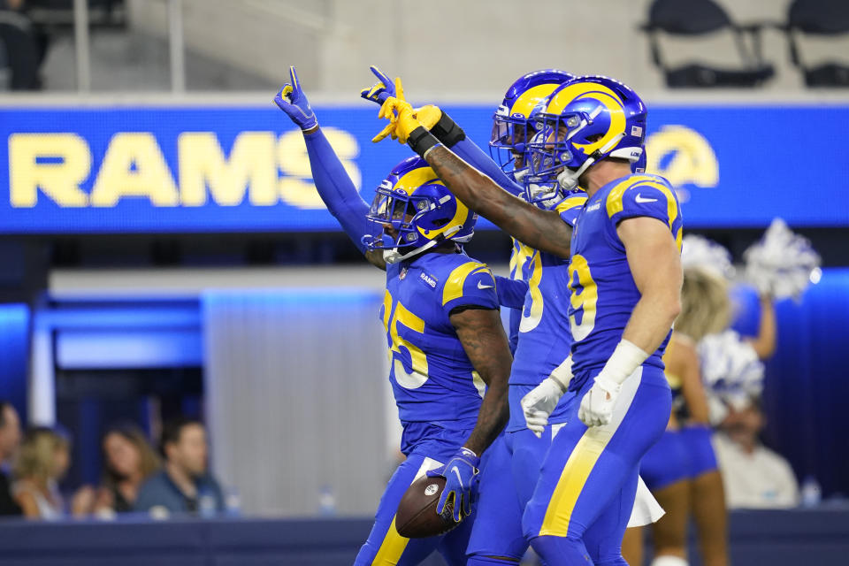 Los Angeles Rams defensive back Brontae Harris, left, celebrates after intercepting a pass during the second half of the team's preseason NFL football game against the Las Vegas Raiders Saturday, Aug. 21, 2021, in Inglewood, Calif. (AP Photo/Ashley Landis )