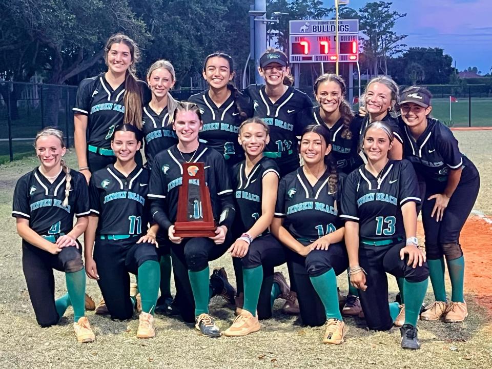 The Jensen Beach softball team poses for photos after winning the District 13-4A title with a 7-1 win over Dr. Joaquin Garcia on Wednesday, May 1, 2024 in Lake Worth.