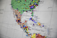 Pins representing the locations people came from who entered the doors of El Refugio while visiting family members detained at the nearby Stewart Detention Center are shown on a map at the organization's house, Sunday, Nov. 10, 2019, in Lumpkin, Ga. In 2019, volunteers hosted 492 overnight guests at the house, according to the organization. (AP Photo/David Goldman)